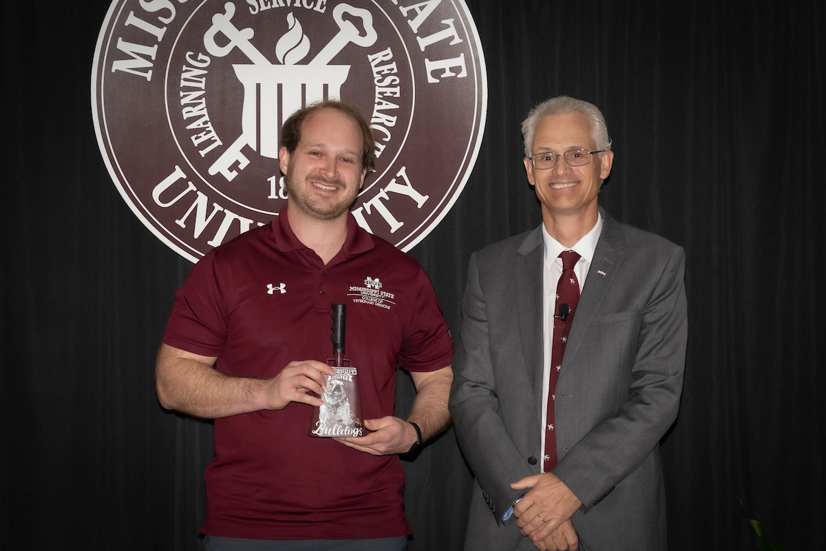 Dr. Alex Shealy receives the Pegasus Award for Teaching from Dr. Nicholas Frank.